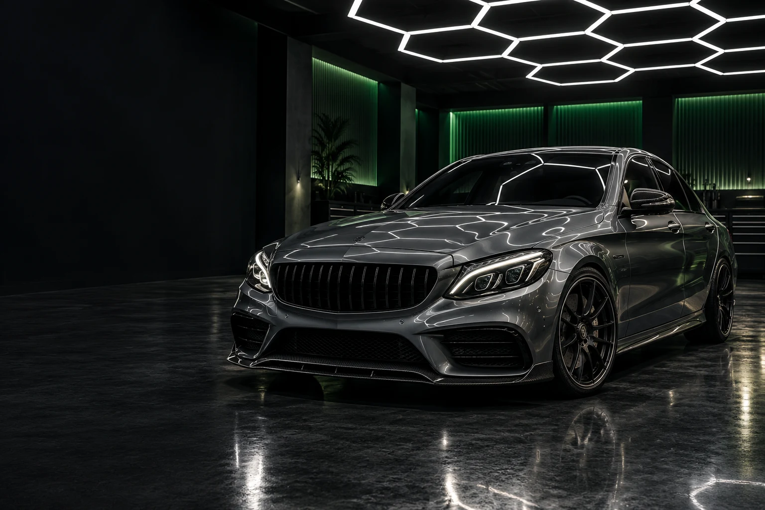 Concept image of a graphite sports sedan beneath hexagon garage lights